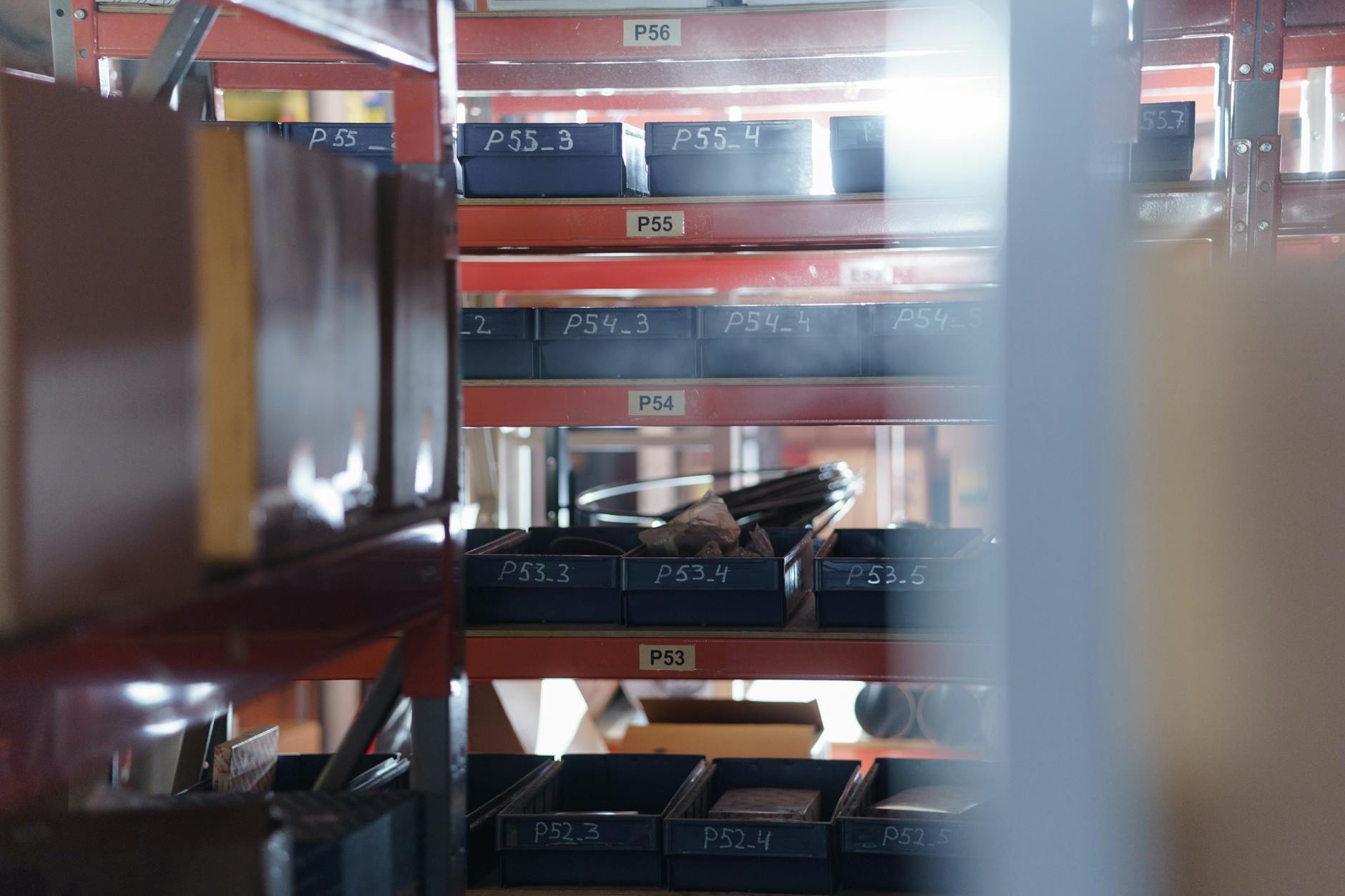 Organized shelving unit with numbered bins for structured inventory management