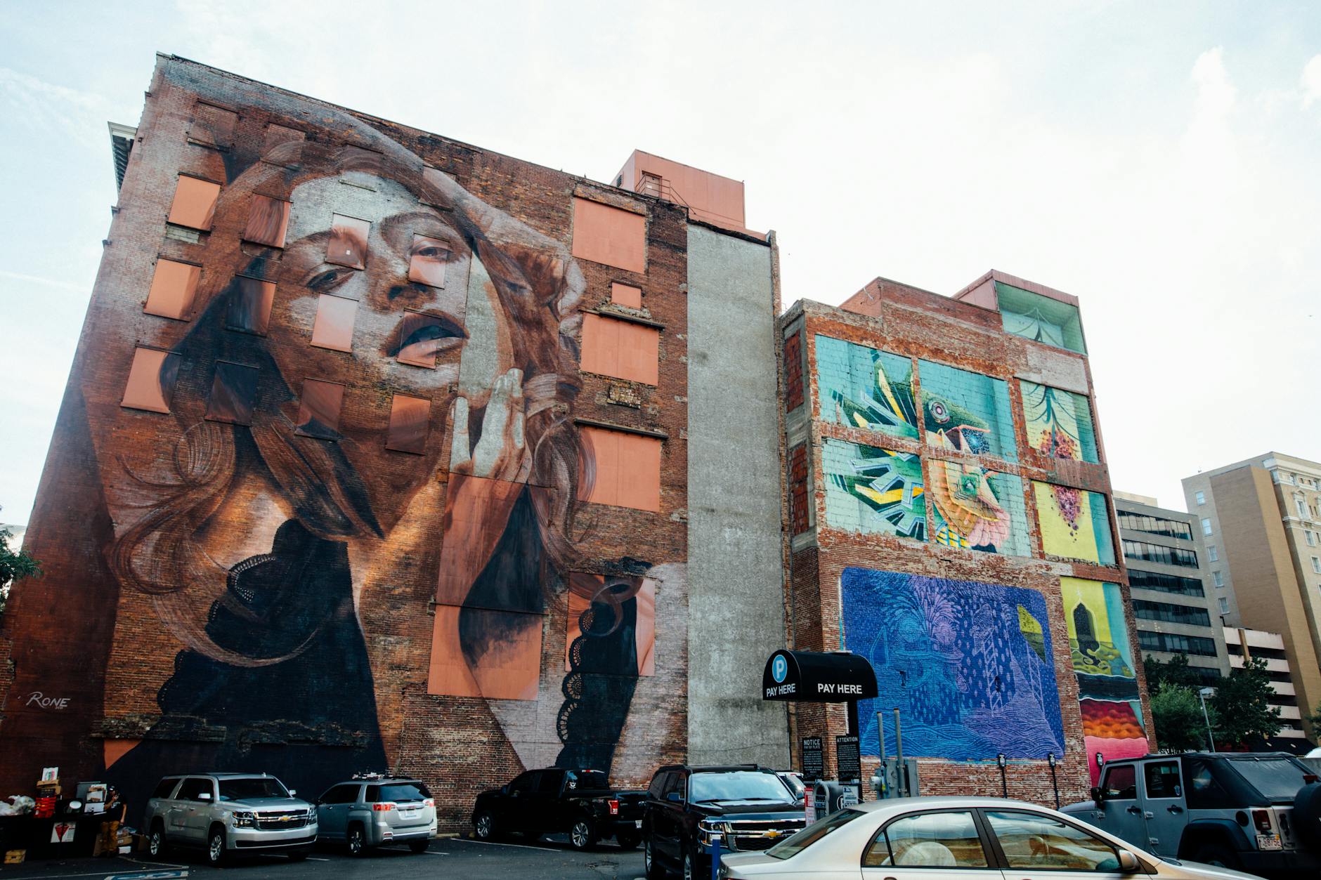 Dynamic street art murals on a city wall showcasing urban creativity