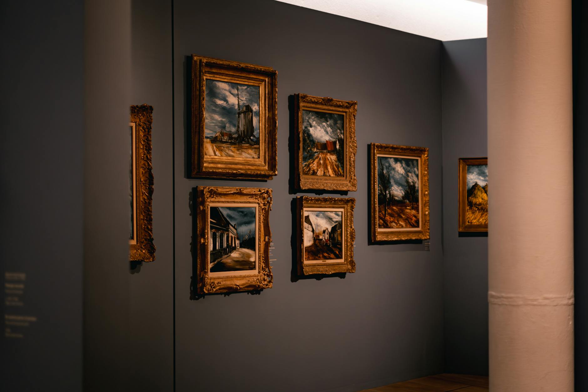 Framed paintings hanging in an art gallery