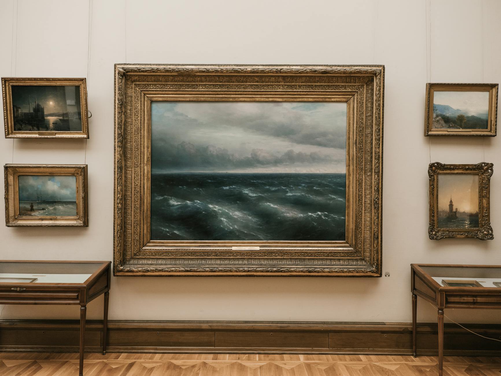 Seascape painting in gold frames in an art gallery